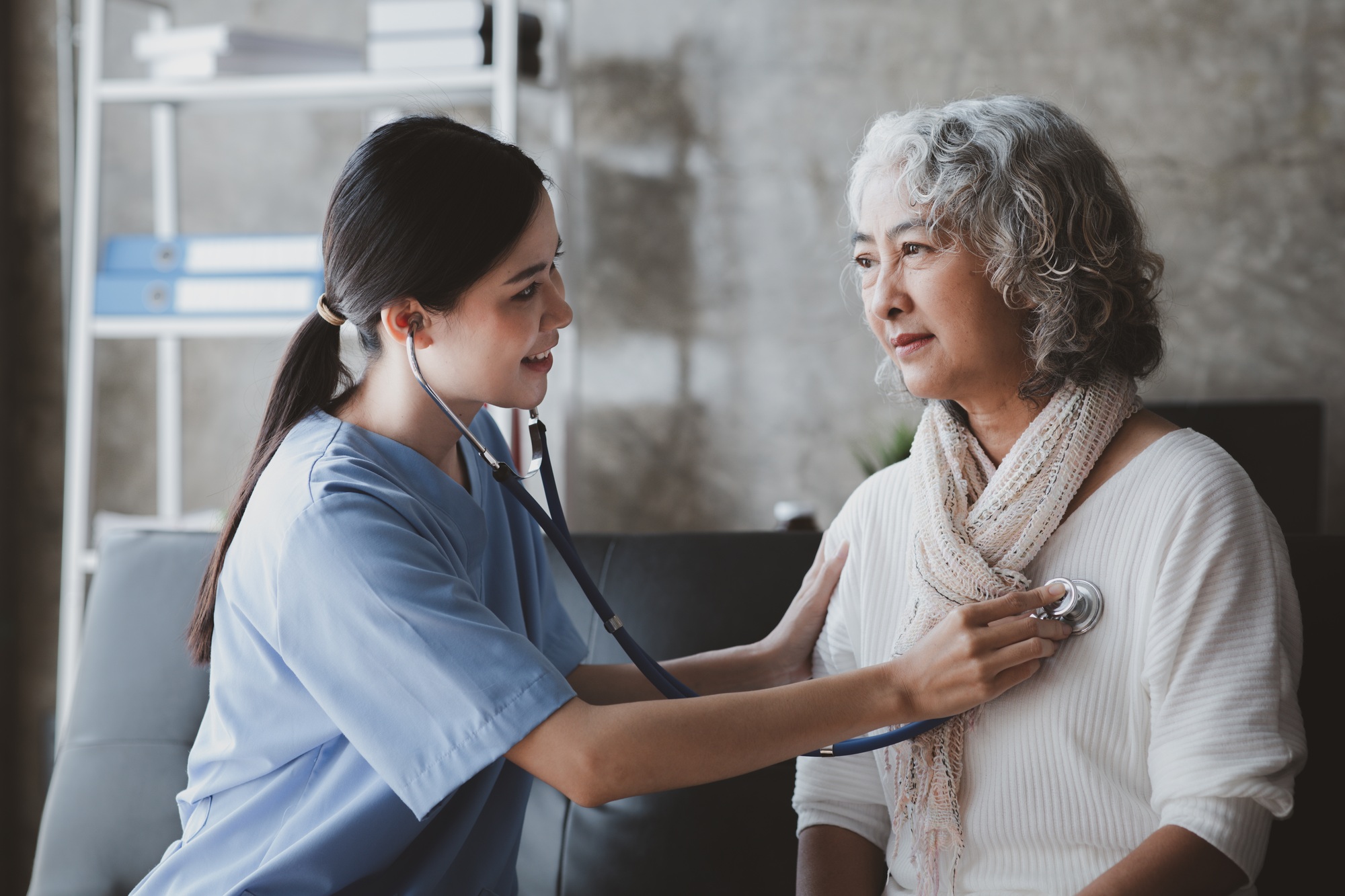 Doctors are talking to explain medication and health care to elderly patients.